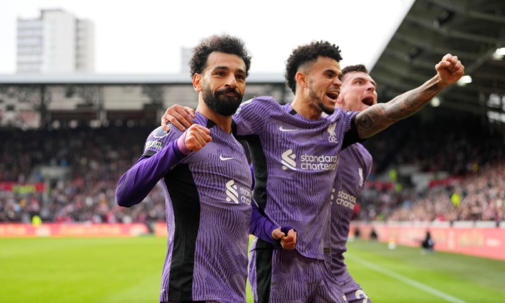 Liverpool's Mohamed Salah celebrates scoring his sides third goal during the English Premier League soccer match between Brentford and Liverpool at the Gtech Community Stadium in London, Saturday, Feb. 17, 2024. (AP Photo/Kirsty Wigglesworth)