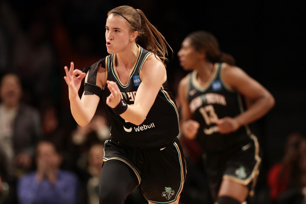 FILE - New York Liberty guard Sabrina Ionescu (20) reacts after making a 3-point basket against the Connecticut Sun in the second half during a WNBA basketball game, Saturday, May 7, 2022, in New York. The Liberty won 81-79. All-Star Saturday Night, Feb. 17, 2024, gets an event like never before: Sabrina Ionescu vs. Stephen Curry, in a 3-point battle of the sexes. (AP Photo/Adam Hunger, File)