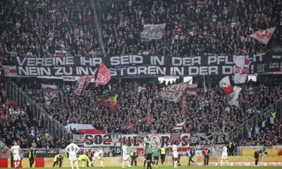 VfB Stuttgart fans hold a banner reading ''Clubs You have a duty - No to investors in the DFL'' during the Bundesliga soccer match between SC Freiburg and VfB Stuttgart at the Europa-Park Stadium in Freiburg im Breisgau, Germany, Saturday Feb. 3, 2024. (Harry Langer/dpa via AP)