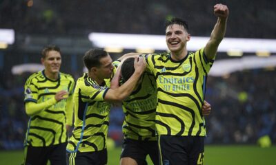 Arsenal's Kai Havertz, centre, celebrates with teammates Declan Rice, right and Cedric Soares after scoring their side's fifth goal of the game , during the English Premier League soccer match between Burnley and Arsenal, at Turf Moor, in Burnley, England, Saturday, Feb. 17, 2024. (Peter Byrne/PA via AP)