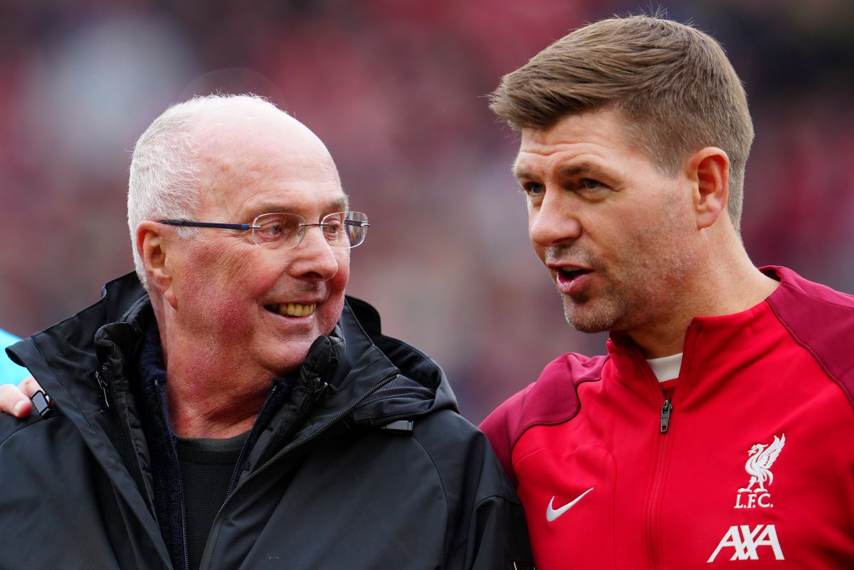 Former England manager Sven-Goran Eriksson stands alongside Steven Gerrard before the start of an exhibition soccer match between Liverpool Legends and Ajax Legends at Anfield Stadium, Liverpool, England, Saturday March 23, 2024. Former England boss Eriksson, who is a lifelong Liverpool fan, disclosed his terminal cancer diagnosis in January. (AP Photo/Jon Super)