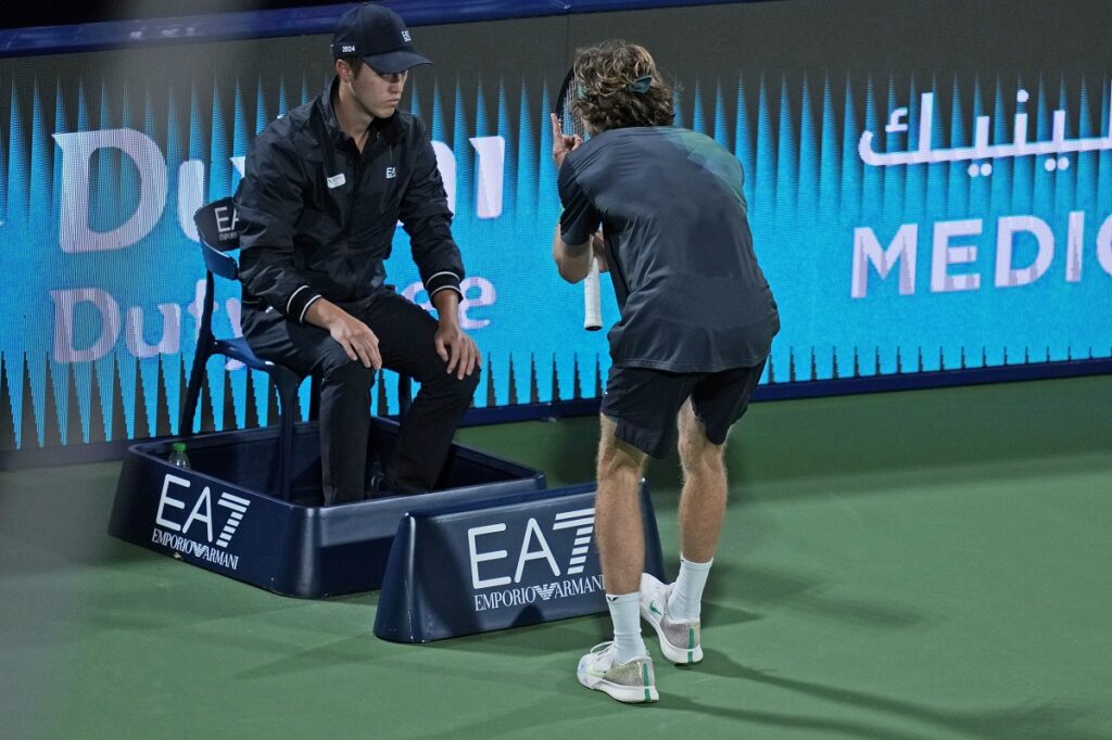 Andrey Rublev reacts in front a linesman during his semi final match with Alexander Bublik of Kazakhstan at the Dubai Duty Free Tennis Championships in Dubai, United Arab Emirates, Friday, March 1, 2024. (AP Photo/Kamran Jebreili)