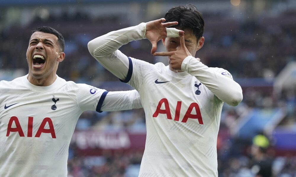 Tottenham Hotspur's Son Heung-Min, right, celebrates scoring against Aston Villa with teammate Pedro Porro during the English Premier League soccer match at Villa Park, Birmingham, England, Sunday March 10, 2024. (Nick Potts/PA via AP)