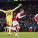 Arsenal's Martin Odegaard, center, celebrates scoring before his goal is then disallowed during the Champions League round of 16, second leg soccer match between Arsenal and Porto at the Emirates Stadium, London, Tuesday March 12, 2024. (Zac Goodwin/PA via AP)