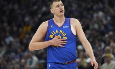 Denver Nuggets center Nikola Jokic walks across the court during the first half of an NBA basketball game against the Minnesota Timberwolves, Tuesday, March 19, 2024, in Minneapolis. (AP Photo/Abbie Parr)