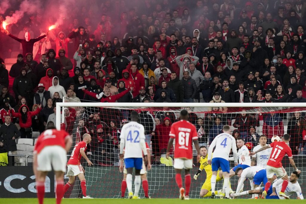 Benfica's fans light flares during the Europa League round of 16, first leg, soccer match between SL Benfica and Rangers FC at the Luz stadium in Lisbon, Thursday, March 7, 2024. (AP Photo/Armando Franca)