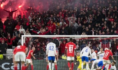 Benfica's fans light flares during the Europa League round of 16, first leg, soccer match between SL Benfica and Rangers FC at the Luz stadium in Lisbon, Thursday, March 7, 2024. (AP Photo/Armando Franca)