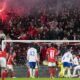 Benfica's fans light flares during the Europa League round of 16, first leg, soccer match between SL Benfica and Rangers FC at the Luz stadium in Lisbon, Thursday, March 7, 2024. (AP Photo/Armando Franca)