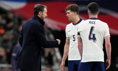 England coach Gareth Southgate speaks to England's John Stones during a friendly soccer match between England and Brazil at Wembley Stadium in London, Saturday, March 23, 2024. (AP Photo/Alastair Grant)