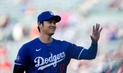 Los Angeles Dodgers designated hitter Shohei Ohtani warms up before an exhibition baseball game against the Los Angeles Angels, Tuesday, March 26, 2024, in Anaheim, Calif. (AP Photo/Ryan Sun)