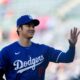 Los Angeles Dodgers designated hitter Shohei Ohtani warms up before an exhibition baseball game against the Los Angeles Angels, Tuesday, March 26, 2024, in Anaheim, Calif. (AP Photo/Ryan Sun)