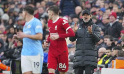 Liverpool's manager Jurgen Klopp instructs his players during the English Premier League soccer match between Liverpool and Manchester City, at Anfield stadium in Liverpool, England, Sunday, March 10, 2024. (AP Photo/Jon Super)