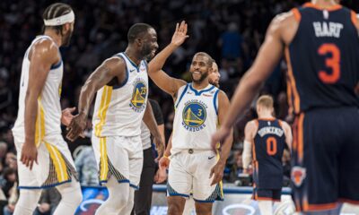 Golden State Warriors players Chris Paul (3), Draymond Green (23), and Moses Moody, left, celebrate during the second half of the team's NBA basketball game against the New York Knicks in New York, Thursday, Feb. 29, 2024. (AP Photo/Peter K. Afriyie)
