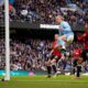 Manchester City's Erling Haaland, centre tries to score during an English Premier League soccer match between Manchester City and Manchester United at the Etihad Stadium in Manchester, England, Sunday, March 3, 2024. (AP Photo/Dave Thompson)