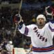 FILE - New York Rangers' Chris Simon celebrates his second-period goal against the New York Islanders, Thursday, Feb. 26, 2004, at Nassau Coliseum in Uniondale, N.Y. Former NHL enforcer Chris Simon has died. He was 52. Simon died Monday night, March 18, 2024, according to a spokesperson for the NHL Players' Association. (AP Photo/Ed Betz, File)