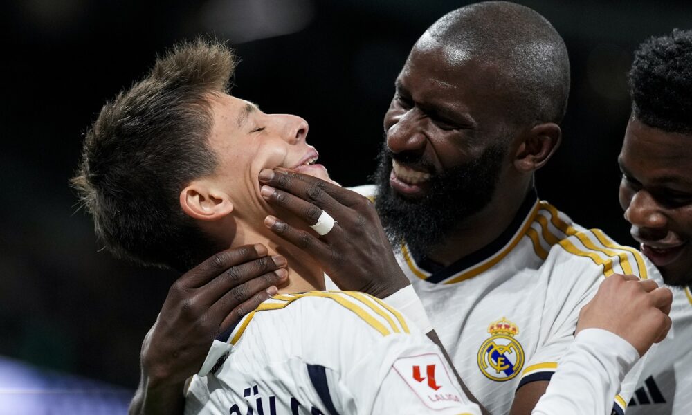 Real Madrid's Arda Guler celebrates with his teammates after scoring his side's fourth goal the Spanish La Liga soccer match between Real Madrid and Celta Vigo at the Santiago Bernabeu stadium in Madrid, Spain, Sunday, March 10, 2024. (AP Photo/Manu Fernandez)