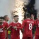 Russia players celebrate after Russia's Ivan Sergeyev scored his side's fourth goal during an international friendly soccer match between Russia and Serbia at the Central Dynamo Stadium of Lev Yashin in Moscow, Russia, Thursday, March 21, 2024. (AP Photo/Alexander Zemlianichenko)