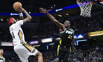 New Orleans Pelicans forward Brandon Ingram shoots against Indiana Pacers forward Jalen Smith (25) during the second half of an NBA basketball game Wednesday, Feb. 28, 2024, in Indianapolis. (AP Photo/Marc Lebryk)