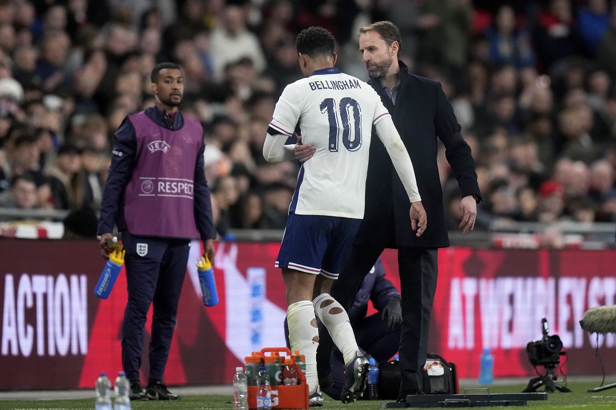 England coach Gareth Southgate speaks to England's Jude Bellingham as he leaves the pitch after being substituted during a friendly soccer match between England and Brazil at Wembley Stadium in London, Saturday, March 23, 2024. (AP Photo/Alastair Grant)
