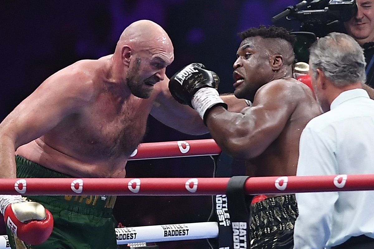 FILE - Tyson Fury, left, fights with Francis Ngannou, right, during their boxing fight in Riyadh, Saudi Arabia, Sunday, Oct. 29, 2023. Former UFC champion Francis Ngannou has already made a dramatic entry into the world of boxing by knocking down Tyson Fury in his first ever fight and taking the world heavyweight champion the distance. Now Ngannou is getting another shot at a high-profile heavyweight when he takes on Anthony Joshua back in Saudi Arabia. (AP Photo/Yazeed Aldhawaihi, File)