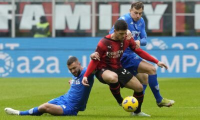 AC Milan's Luka Jovic, centre, challenges for the ball with Empoli's Sebastian Walukiewicz, left, and Empoli's Szymon Zurkowski during a Serie A soccer match between AC Milan and Empoli at the San Siro stadium in Milan, Italy, Sunday, March 10, 2024. (AP Photo/Luca Bruno)