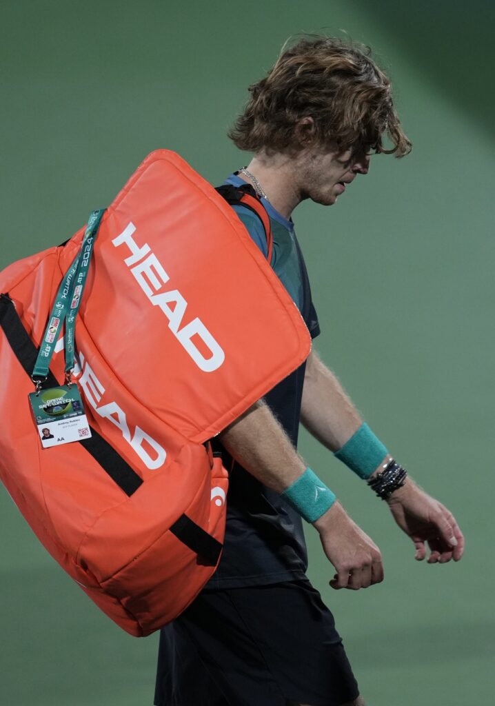 Andrey Rublev leaves the court after being disqualified during a semi final match against Alexander Bublik of Kazakhstan at the Dubai Duty Free Tennis Championships in Dubai, United Arab Emirates, Friday, March 1, 2024. (AP Photo/Kamran Jebreili)