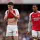Arsenal's Declan Rice, left, reacts besides Arsenal's Gabrielvduring the English Premier League soccer match between Arsenal and Aston Villa at the Emirates stadium in London, Sunday, April 14, 2024. (AP Photo/Kirsty Wigglesworth)