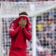 Liverpool's Curtis Jones reacts after missing a scoring chance during the English Premier League soccer match between Liverpool and Crystal Palace at Anfield Stadium in Liverpool, England, Sunday, April 14, 2024. (AP Photo/Jon Super)