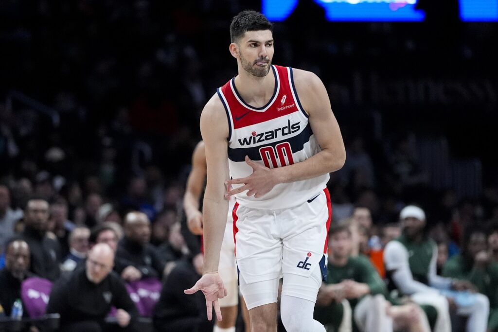 Washington Wizards forward Tristan Vukcevic celebrates a three-point shot during the second half of an NBA basketball game against the Milwaukee Bucks, Tuesday, April 2, 2024, in Washington. The Wizards won 117-113. (AP Photo/Alex Brandon)