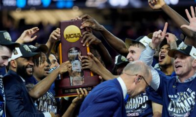 UConn celebrates with the trophy after their win against Purdue in the NCAA college Final Four championship basketball game, Monday, April 8, 2024, in Glendale, Ariz. (AP Photo/David J. Phillip)