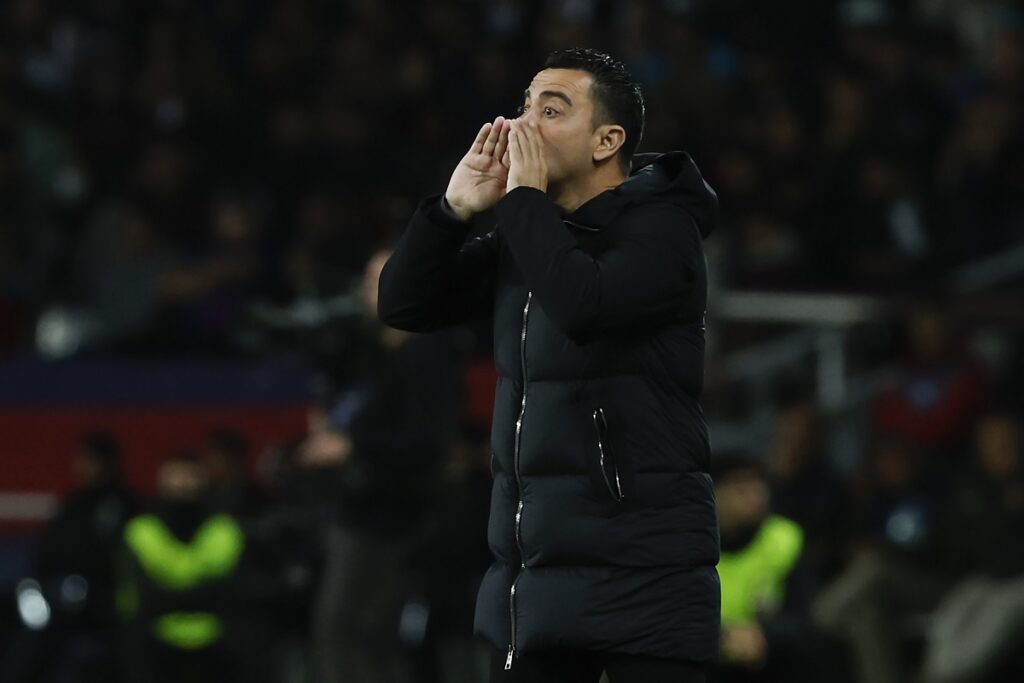 Barcelona's head coach Xavi Hernandez gives directions to his players during the Champions League quarterfinal second leg soccer match between Barcelona and Paris Saint-Germain at the Olimpic Lluis Companys stadium in Barcelona, Spain, Tuesday, April 16, 2024. (AP Photo/Joan Monfort)