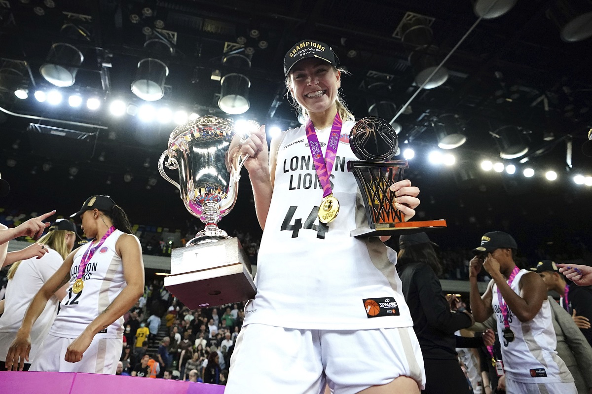 London Lions' Karlie Samuelson holds the winner's trophy and MVP trophy following the second leg of the EuroCup women's basketball final against Besiktas, Wednesday, April 10, 2024, at the Copperbox Arena in London. (Zac Goodwin/PA via AP)