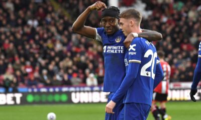 Chelsea's Noni Madueke celebrates with Chelsea's Cole Palmer after scoring his side's second goal during the English Premier League soccer match between Sheffield United and Chelsea at Bramall Lane stadium in Sheffield, England, Sunday, April 7, 2024. (AP Photo/Rui Vieira)