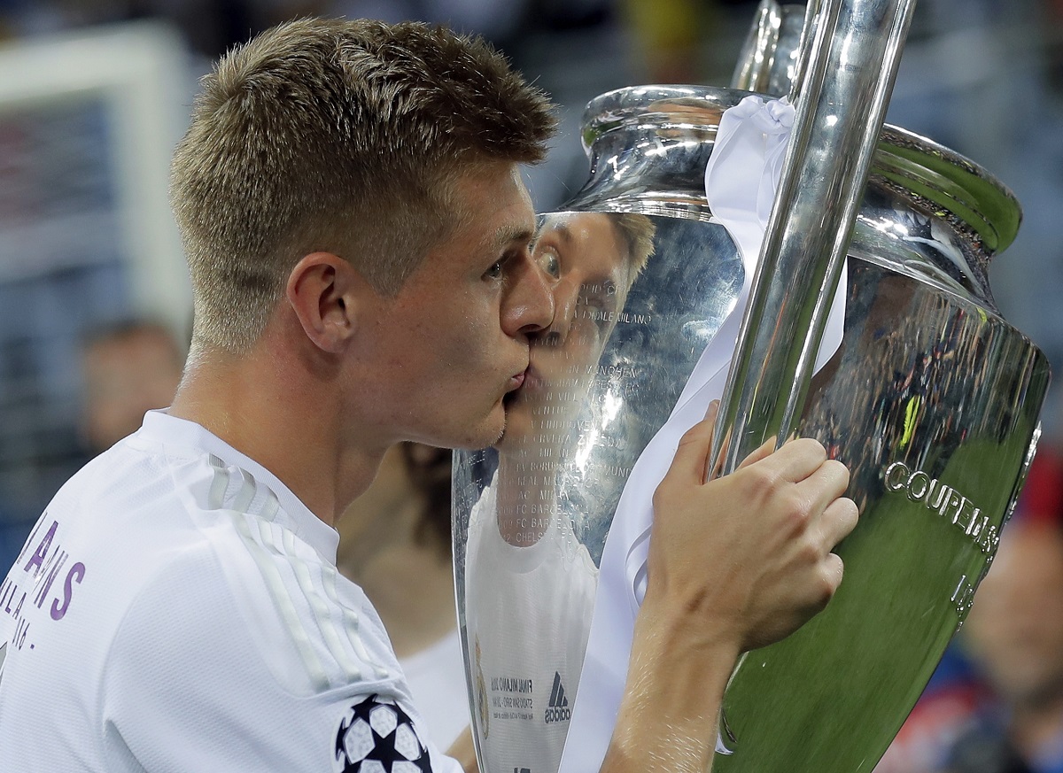 Real Madrid's Toni Kros celebrates with the trophy after the Champions League final soccer match between Real Madrid and Atletico Madrid at the San Siro stadium in Milan, Italy, on May 28, 2016. Real Madrid said the 34-year-old German international “has decided to bring an end to his time as a professional footballer following Euro 2024.” (AP Photo/Manu Fernandez)