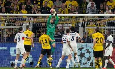 PSG's goalkeeper Gianluigi Donnarumma, top, catches the ball during the Champions League semifinal first leg soccer match between Borussia Dortmund and Paris Saint-Germain at the Signal-Iduna Park in Dortmund, Germany, Wednesday, May 1, 2024. (AP Photo/Martin Meissner)