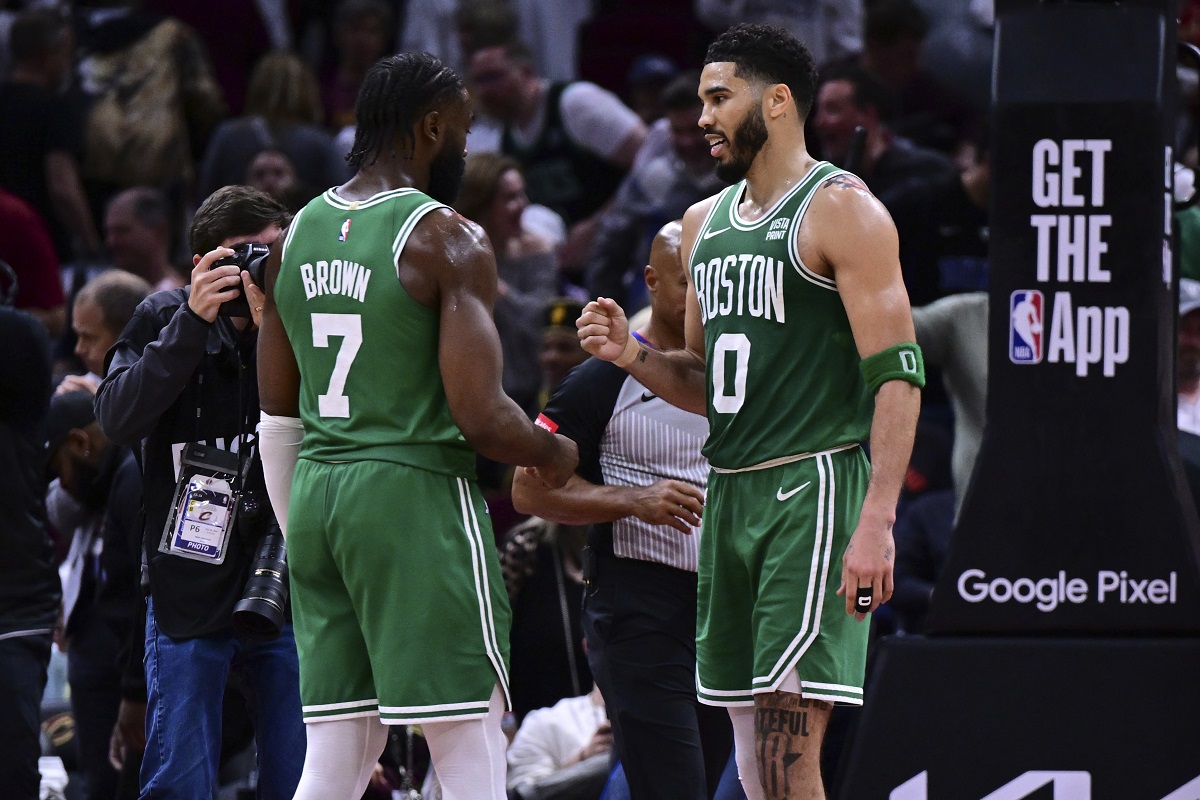 Boston Celtics forward Jayson Tatum (0) congratulates guard Jaylen Brown (7) after they defeated the Cleveland Cavaliers in Game 4 of an NBA basketball second-round playoff series, Monday, May 13, 2024, in Cleveland. (AP Photo/David Dermer)