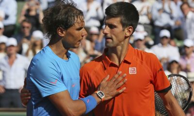 FILE - Serbia's Novak Djokovic hugs Spain's Rafael Nadal, left, after winning the quarterfinal match of the French Open tennis tournament in three sets, 7-5, 6-3, 6-1, at Roland Garros stadium, in Paris, France, Wednesday, June 3, 2015. There have been 59 installments of Nadal vs. Djokovic, more than between any two other men in the Open era of tennis, which dates to 1968. Djokovic leads 30-29 overall. (AP Photo/David Vincent, File)