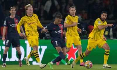PSG's Kylian Mbappe, center, passes the ball during the Champions League semifinal second leg soccer match between Paris Saint-Germain and Borussia Dortmund at the Parc des Princes stadium in Paris, France, Tuesday, May 7, 2024. (AP Photo/Frank Augstein)