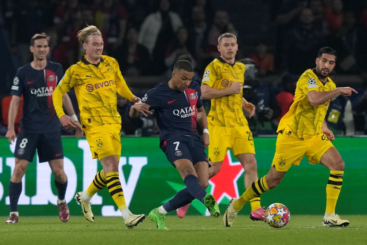 PSG's Kylian Mbappe, center, passes the ball during the Champions League semifinal second leg soccer match between Paris Saint-Germain and Borussia Dortmund at the Parc des Princes stadium in Paris, France, Tuesday, May 7, 2024. (AP Photo/Frank Augstein)