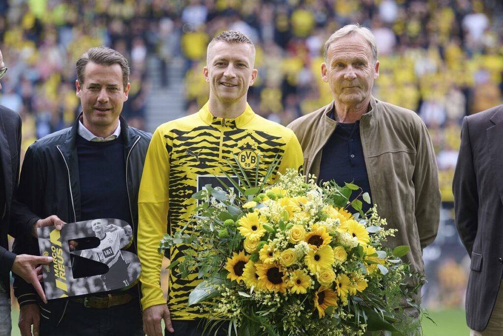 Dortmund's Marco Reus is congratulated before the Bundesliga soccer match between Borussia Dortmund and SV Darmstadt 98 at the Signal Iduna Park in Dortmund, Germany, Saturday May 18, 2024. This is last game of Marco Reus with Dortmund. (Bernd Thissen/dpa via AP)