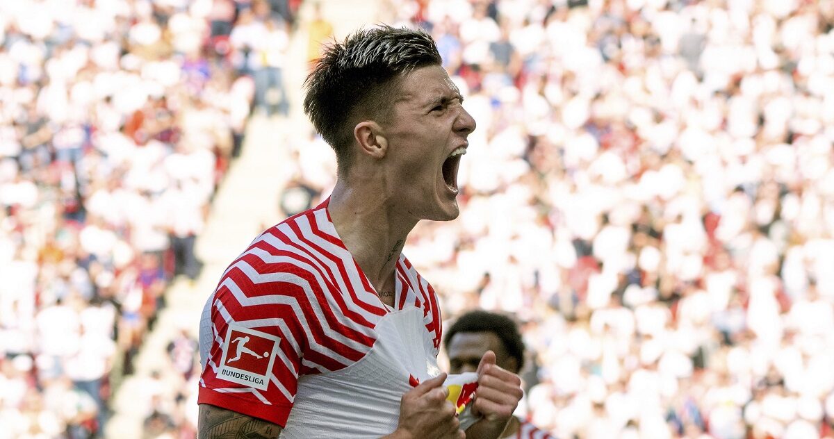 Leipzig's Benjamin Sesko celebrates after scoring his side's first goal during German Bundesliga soccer match between RB Leipzig and Werder Bremen in Leipzig, Germany, Saturday, May 11, 2024. (Hendrik Schmidt/dpa via AP)