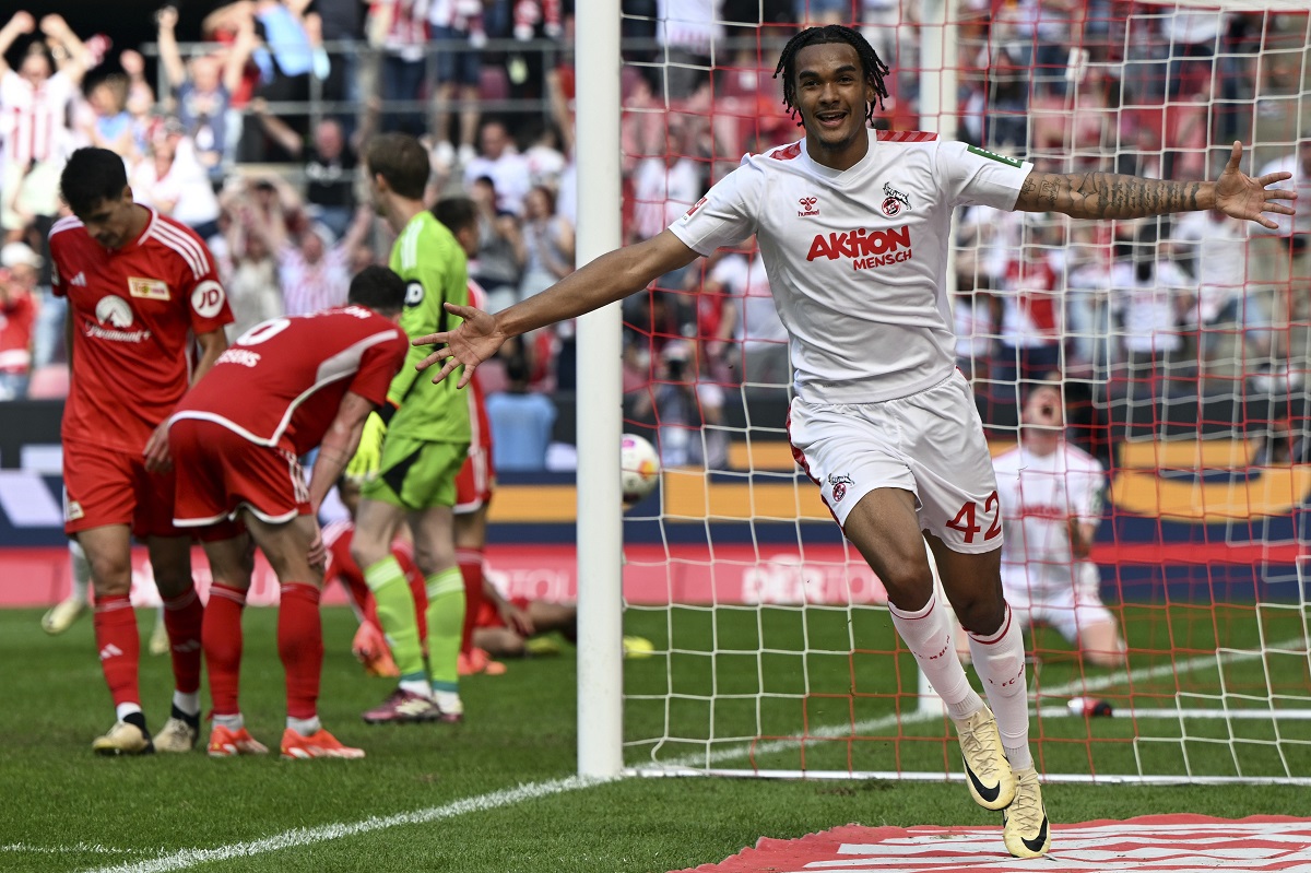 Cologne's Damion Downs celebrates after scoring his side's third goal during German Bundesliga soccer match between 1. FC Cologne and 1. FC Union Berlin in Cologne, Germany, Saturday, May 11, 2024. (Federico Gambarini/dpa via AP)
