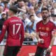 Manchester United's Alejandro Garnacho, left, celebrates after scoring his side's opening goal with his teammate Bruno Fernandes during the English FA Cup final soccer match between Manchester City and Manchester United at Wembley Stadium in London, Saturday, May 25, 2024. (AP Photo/Kin Cheung)