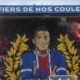 A giant painting depicting PSG's Kylian Mbappe is displayed before the French League One soccer match between Paris Saint-Germain and Toulouse at the Parc des Princes stadium in Paris, Sunday, May 12, 2024. (AP Photo/Christophe Ena)