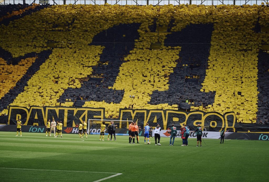 Dortmund fans thank Marco Reus before the Bundesliga soccer match between Borussia Dortmund and SV Darmstadt 98 at the Signal Iduna Park in Dortmund, Germany, Saturday May 18, 2024. This is the last match of Marco Reus with Borussia Dortmund. (Bernd Thissen/dpa via AP)
