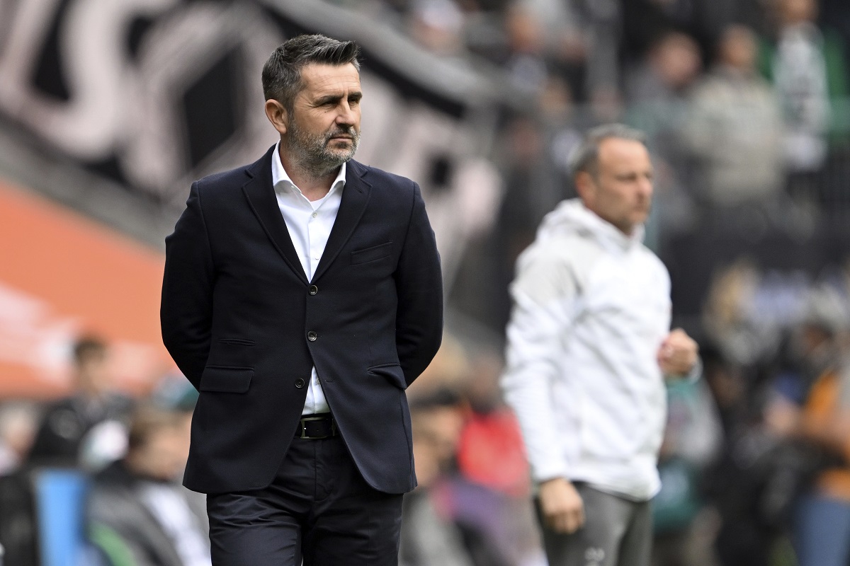 Berlin's head coach Nenad Bjelica, front, follows the German Bundesliga soccer match between Borussia Moenchengladbach and 1. FC Union Berlin in Moenchengladbach, Germany, Sunday, April 28, 2024. (Federico Gambarini/dpa via AP)