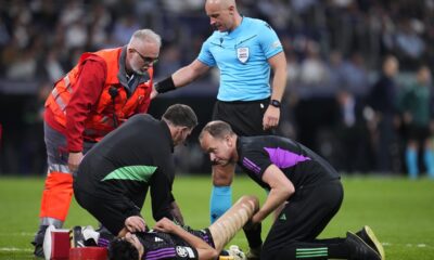Bayern's Aleksandar Pavlovic receives treatment from medical staff during the Champions League semifinal second leg soccer match between Real Madrid and Bayern Munich at the Santiago Bernabeu stadium in Madrid, Spain, Wednesday, May 8, 2024. (AP Photo/Manu Fernandez)