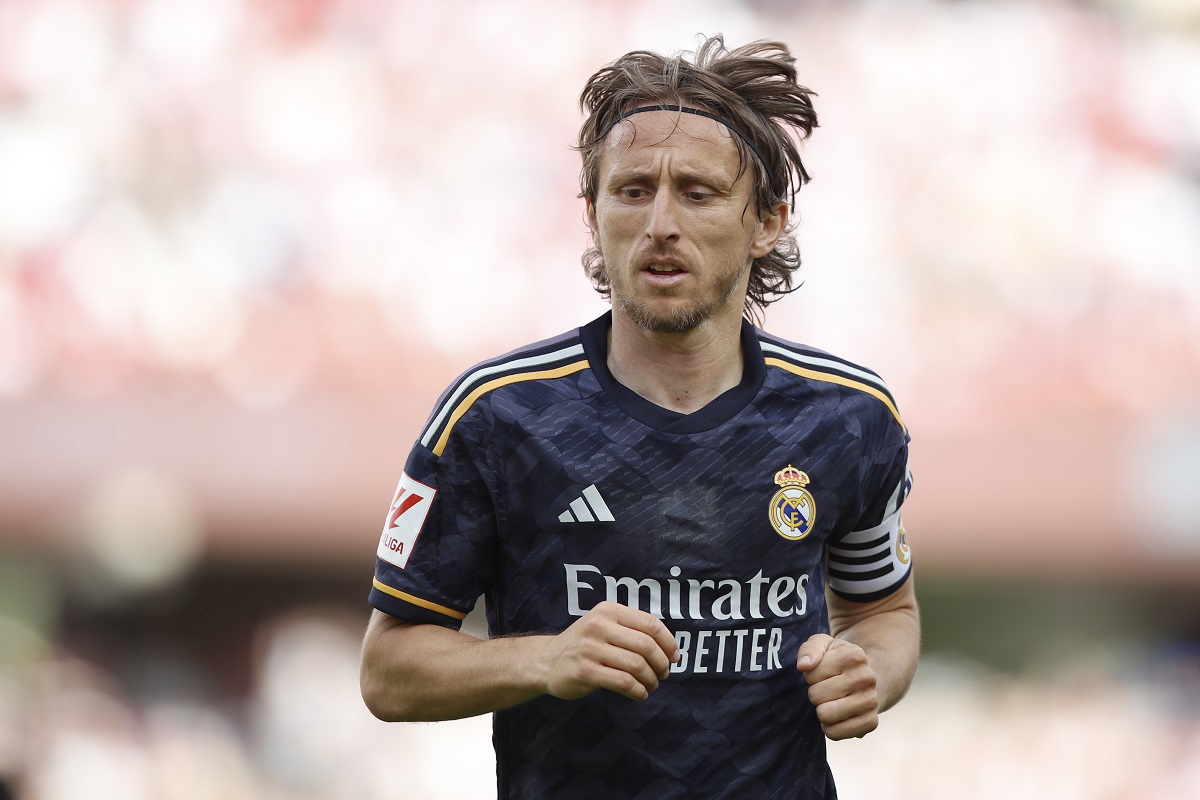 Real Madrid's Luka Modric runs on the pitch during a Spanish La Liga soccer match between Granada FC and Real Madrid at Los Carmanes stadium in Granada, Spain, Saturday, May 11, 2024. (AP Photo/Fermin Rodriguez)