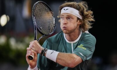 Andrey Rublev, of Russia, returns the ball to Carlos Alcaraz, of Spain, during the Mutua Madrid Open tennis tournament in Madrid, Wednesday, May 1, 2024. (AP Photo/Manu Fernandez)