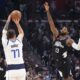 Dallas Mavericks guard Luka Doncic, center, shoots as Los Angeles Clippers forward Paul George, right, and guard James Harden defend during the first half in Game 2 of an NBA basketball first-round playoff series Tuesday, April 23, 2024, in Los Angeles. (AP Photo/Mark J. Terrill)